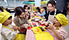 Children make gimbap with their mothers during a special cooking class at a day care center in Buk District, Gwangju, on Dec. 6, 2024. [GWANGJU'S BUK DISTRICT OFFICE]
