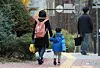 A child holds his mother’s hand on the way to a daycare center on Nov. 20, 2024. [NEWS1]
