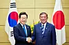 President Lee Jae Myung, left, and Japanese Prime Minister Shigeru Ishiba shake hands ahead of their bilateral summit at the prime minister's official residence in Tokyo on Aug. 23. [JOINT PRESS CORPS]