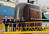 Korean Prime Minister Kim Min-seok, center, Canadian Prime Minister Mark Carney, second from right, and Hanwha Group Vice Chairman Kim Dong-kwan, right, tours Hanwha Ocean's shipyard in Geoje, South Gyeongsang, on Oct. 30. [YONHAP]