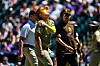 Kim Ha-seong of the San Diego Padres comes out of the game with an apparent shoulder injury after sliding to avoid a pickoff attempt at first base in the third inning against the Colorado Rockies at Coors Field in Denver, Colorado on Sunday. [AFP/YONHAP]