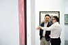 People at Art Taipei 2025 discuss paintings [TAIWAN ART GALLERY ASSOCIATION]