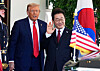 U.S. President Donald Trump, left, greets President Lee Jae Myung upon his arrival at the White House in Washington on Aug. 25. [AP/YONHAP]