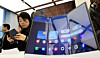 Visitors try out the Galaxy Z TriFold during Samsung Electronics’ Galaxy Z Trifold launch media day event at Samsung Gangnam in southern Seoul on Dec. 2. [YONHAP]