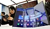 Visitors try out the Galaxy Z TriFold during Samsung Electronics’ Galaxy Z Trifold launch media day event at Samsung Gangnam in southern Seoul on Dec. 2. [YONHAP]